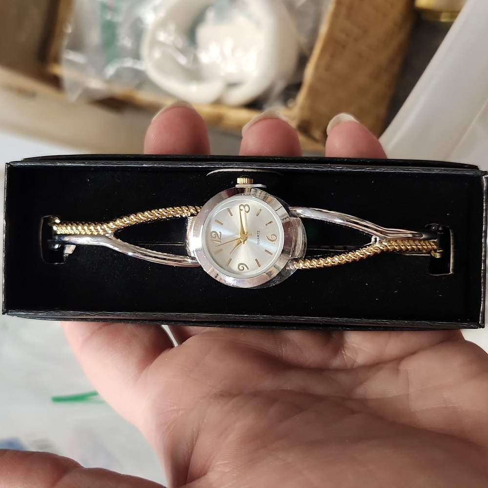Avon vintage two tone gold and sliver watch.